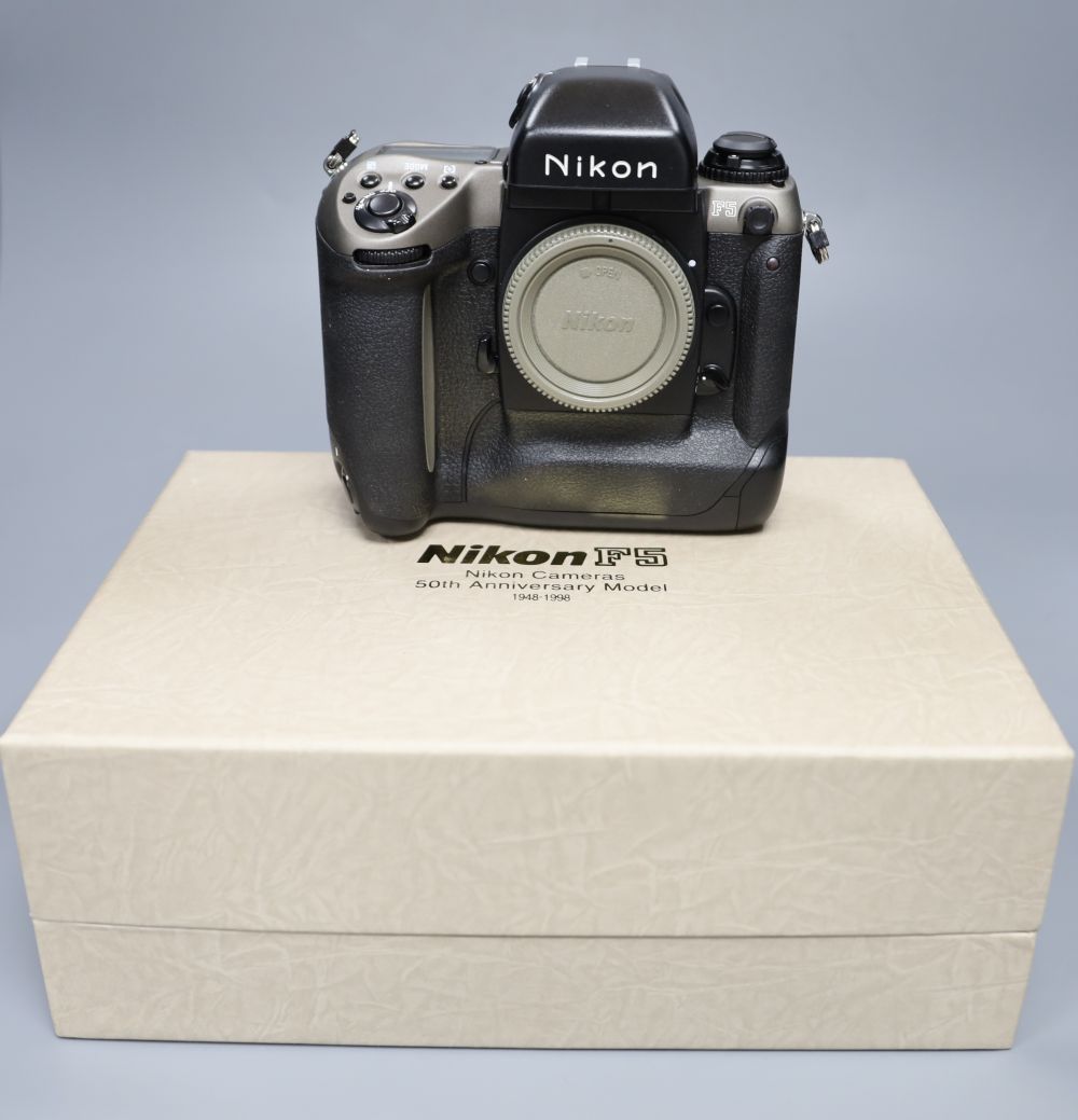 A Nikon F5 SLR camera body in original 50th Anniversary model boxed, virtually mint